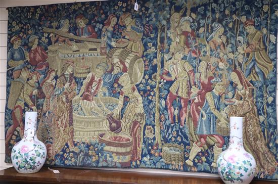 A machine tapestry depicting a medieval wine harvest